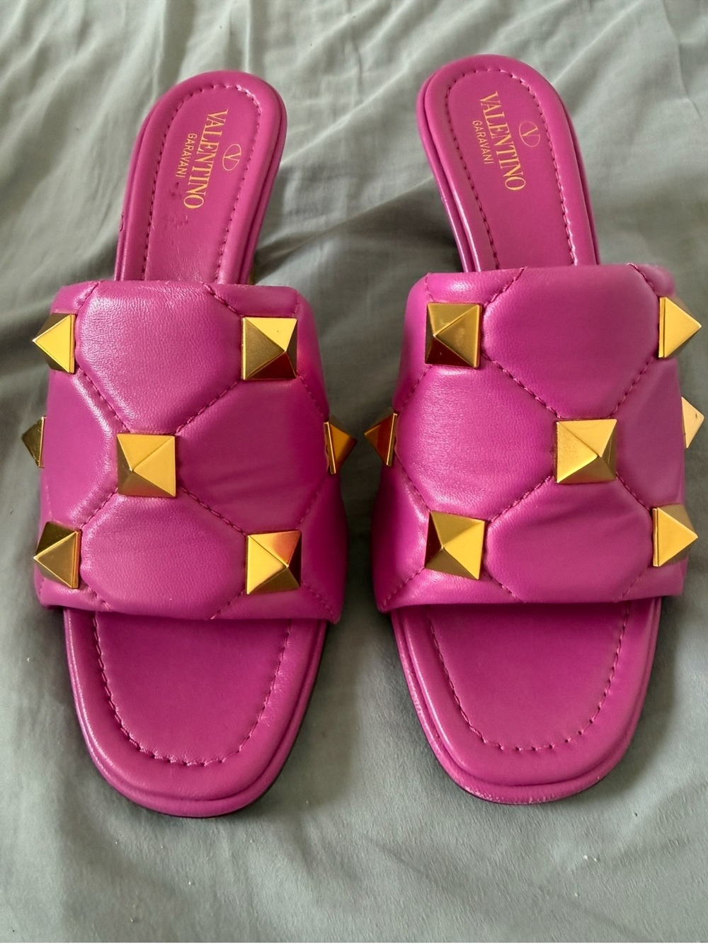 Valentino Garavani Pink Quilted Slide Mules with Gold Pyramid Studs